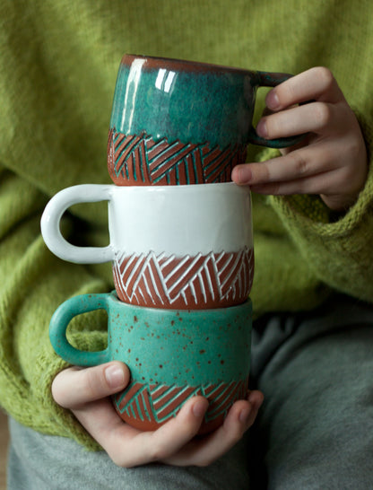Mok met turquoise satijnvisgraatmotief